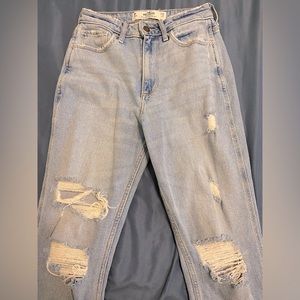 Hollister curvy-high rise mom jeans, light wash. Rips on both legs.